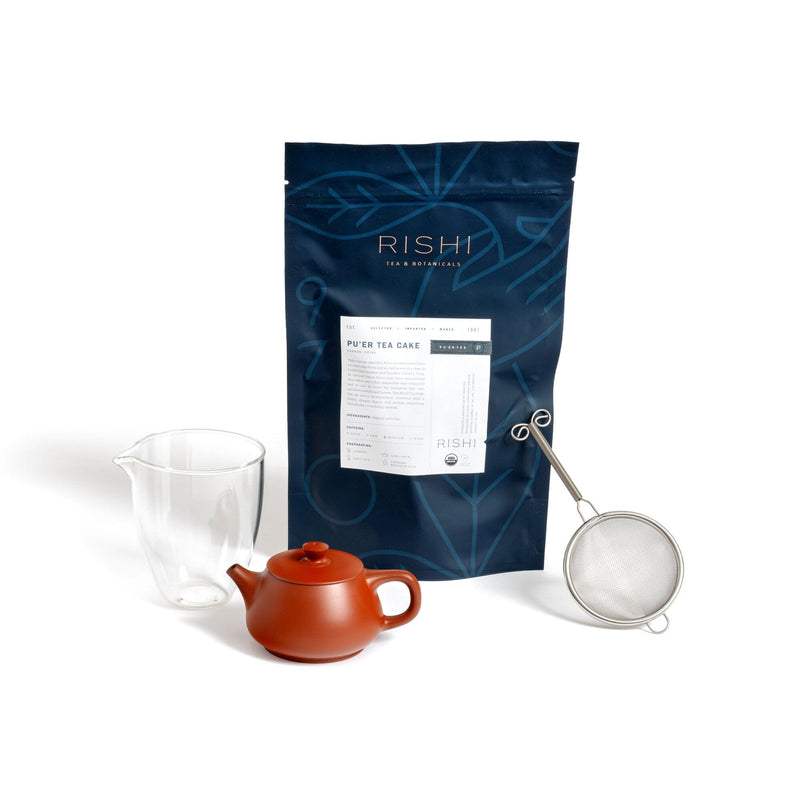 This Pu’er Tea Gongfu Cha Bundle from Rishi Tea & Botanicals includes a teapot and tea strainer, perfect for brewing tea. Additionally, it comes with a bag of Shu pu’er tea cake for an authentic and enjoyable tea.
