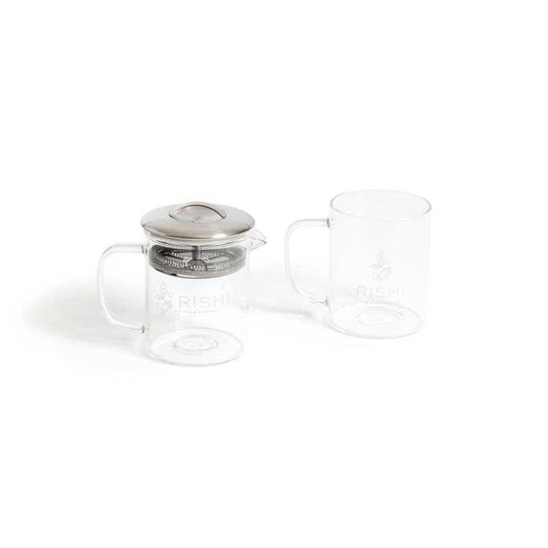 Two Tea for One Simple Brew & Mug Sets by Rishi Tea & Botanicals on a white surface, perfect for tea brewing enthusiasts. The set includes the elegant Simple Brew teapot and the sleek Simple Mug.