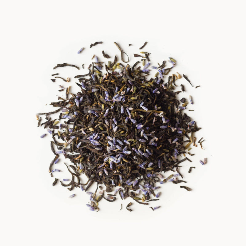 A pile of Earl Grey Lavender tea from Rishi Tea & Botanicals on a white background.