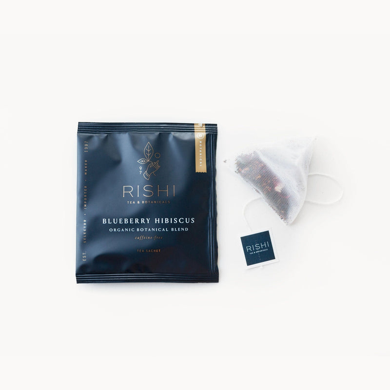 A bag of Blueberry Hibiscus tea with a Rishi Tea & Botanicals tea bag on it.