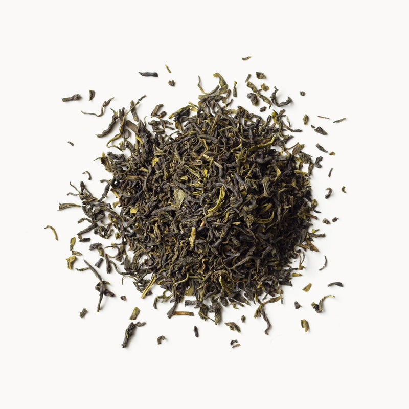 A pile of Jasmine tea from Rishi Tea & Botanicals on a white background.