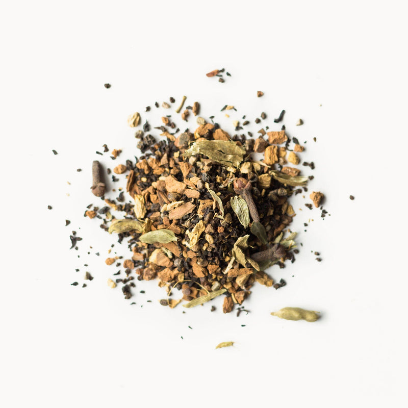 A pile of Masala Chai from Rishi Tea & Botanicals on a white background.