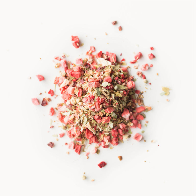 A pile of Patagonia Wild Guava from Rishi Tea & Botanicals on a white surface.