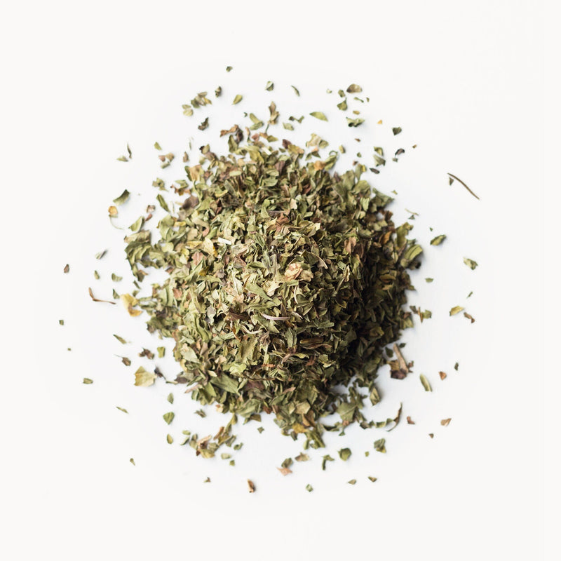 A pile of Rishi Tea & Botanicals Peppermint on a white background.