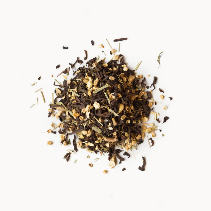 A pile of Pu'er Ginger tea from Rishi Tea & Botanicals on a white background.
