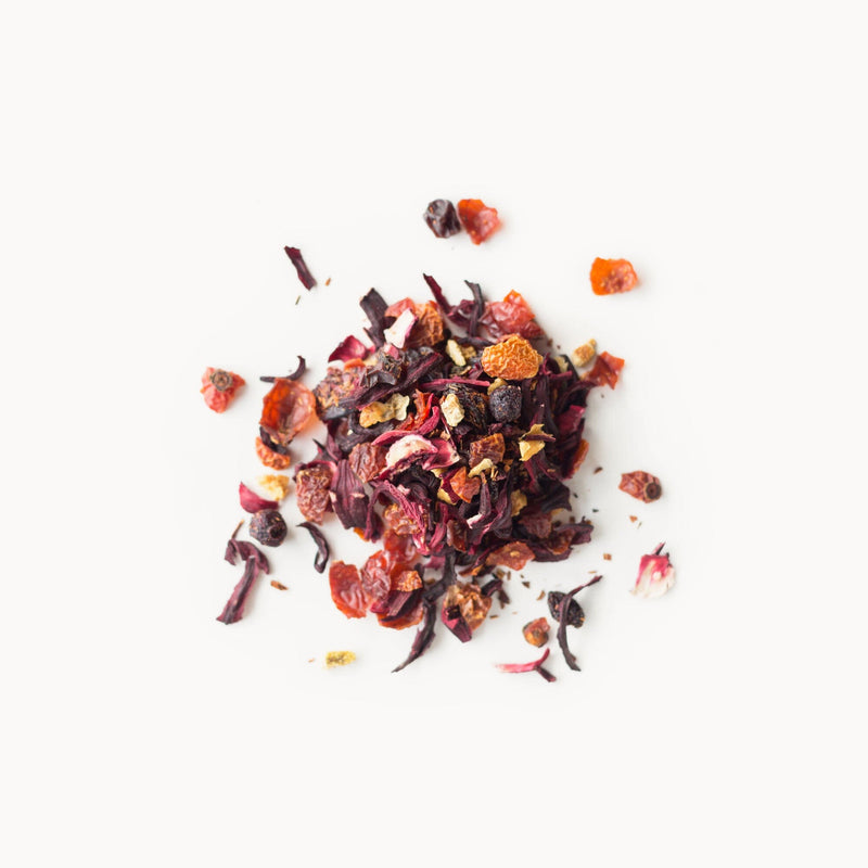A pile of Scarlet dried fruit and nuts on a white background from Rishi Tea & Botanicals.