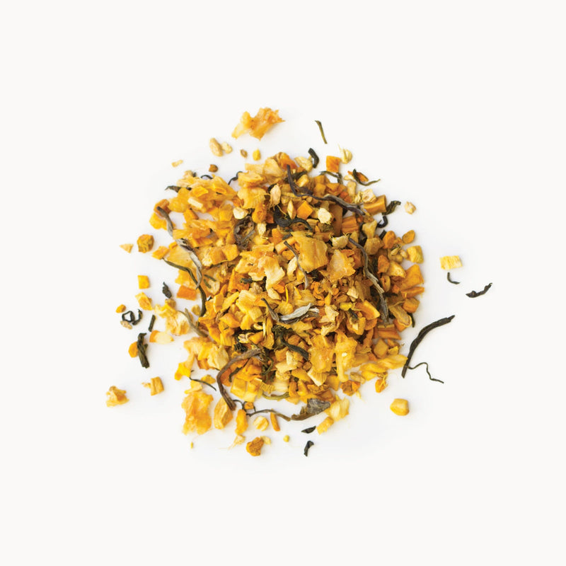 A pile of Turmeric Mango tea by Rishi Tea & Botanicals on a white background.