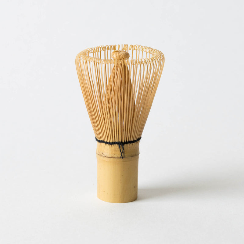 A Bamboo Matcha Tea Whisk by Hangzhou Green Rock Co., Ltd. on a white background.