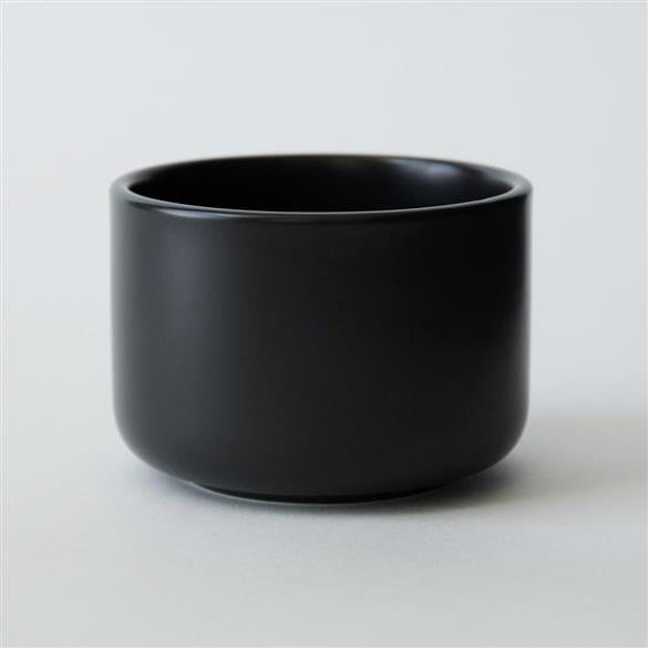 An Everyday Matcha Bowl by Rishi Tea & Botanicals sitting on a white surface.