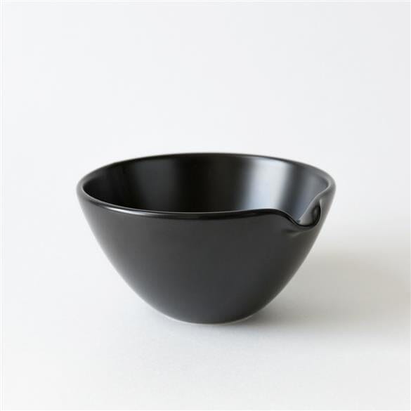 A Matcha Pouring Bowl sitting on a white surface. (Brand: Rishi Tea & Botanicals)