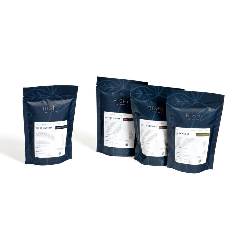 Three bags of China Flight of Tea Bundle by Rishi Tea & Botanicals on a white background featuring Chinese regions.