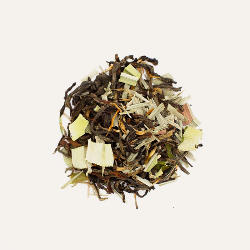 A pile of Pandan Red Tea leaves from ancient tea trees by Rishi Tea & Botanicals on a white background.
