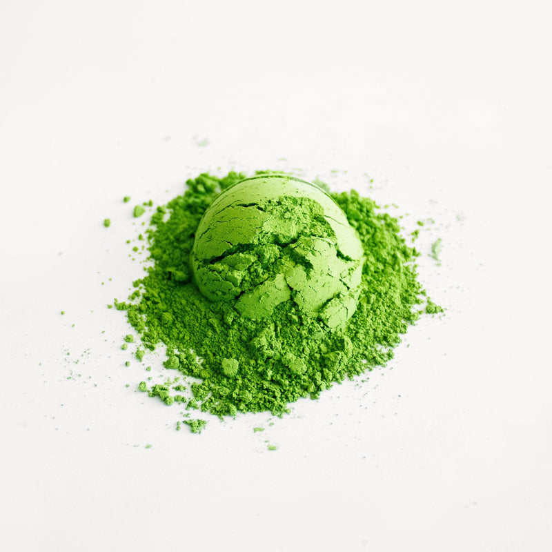 A proprietary blend of Matcha Ukitsu tea, a vibrant green powder, displayed on a clean white background.