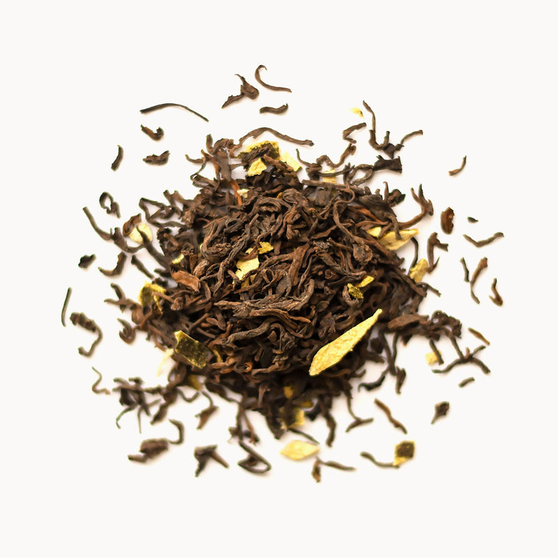 A pile of aged New Citrus Peel Pu’er tea from Rishi Tea & Botanicals on a white background.