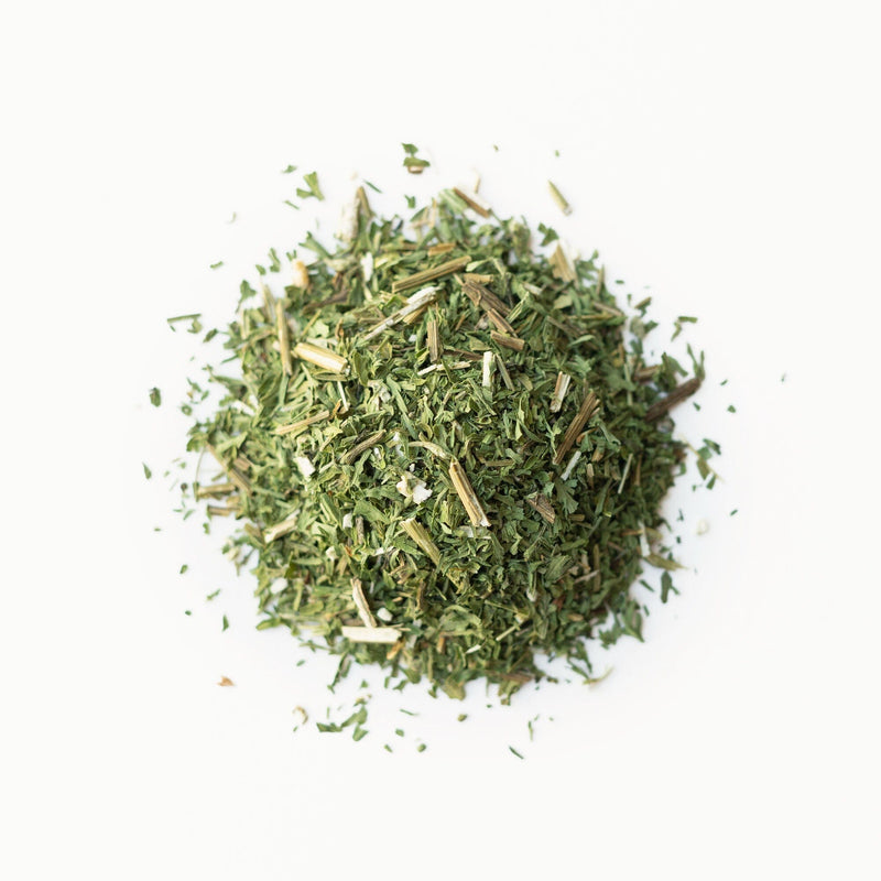 A pile of Rishi Tea & Botanicals Artemisia on a white background.