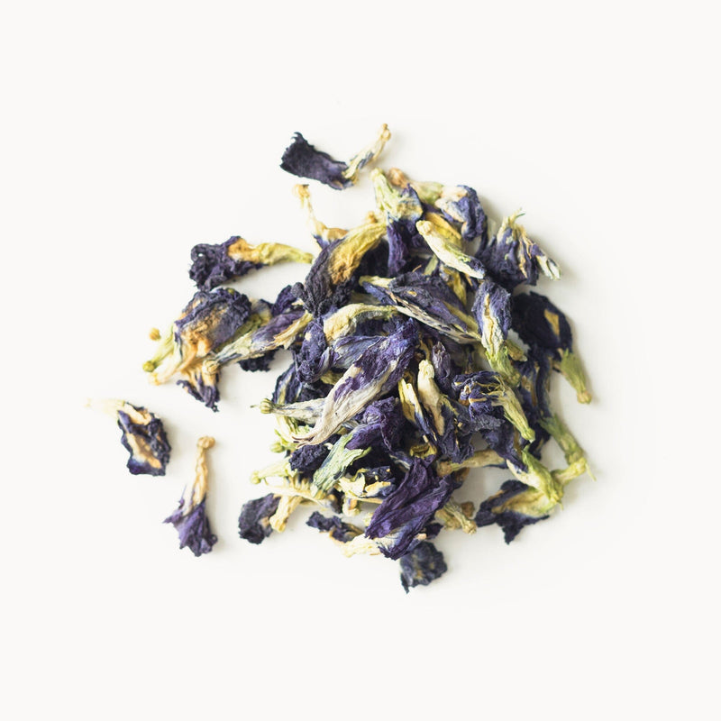 A pile of Butterfly Pea Flowers from Rishi Tea & Botanicals on a white background.
