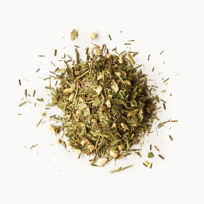 A pile of Ginger Lime Rooibos from Rishi Tea & Botanicals on a white background.