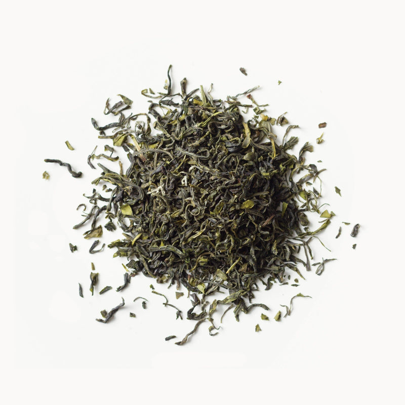 A pile of Jade Cloud green tea on a white background by Rishi Tea & Botanicals.