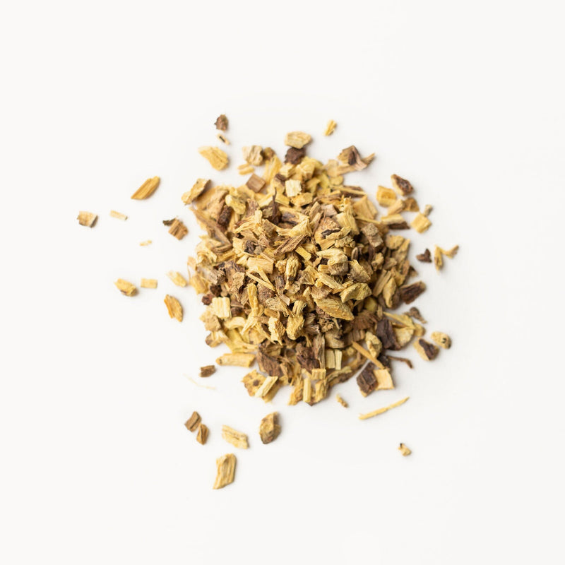 A pile of Licorice Root sticks from Rishi Tea & Botanicals on a white background.