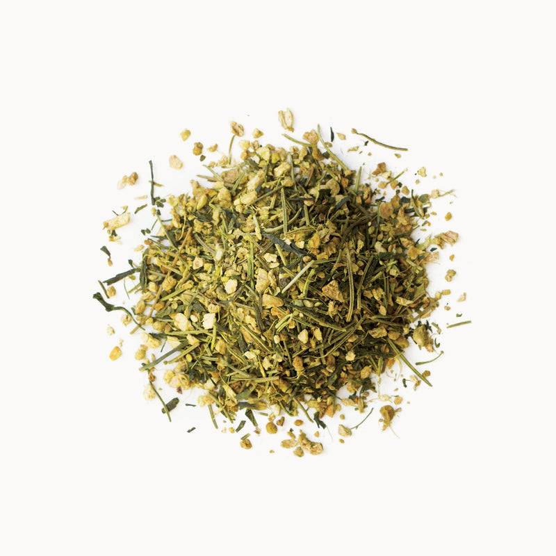 A pile of Matcha Ginger Buzz from Rishi Tea & Botanicals on a white background.