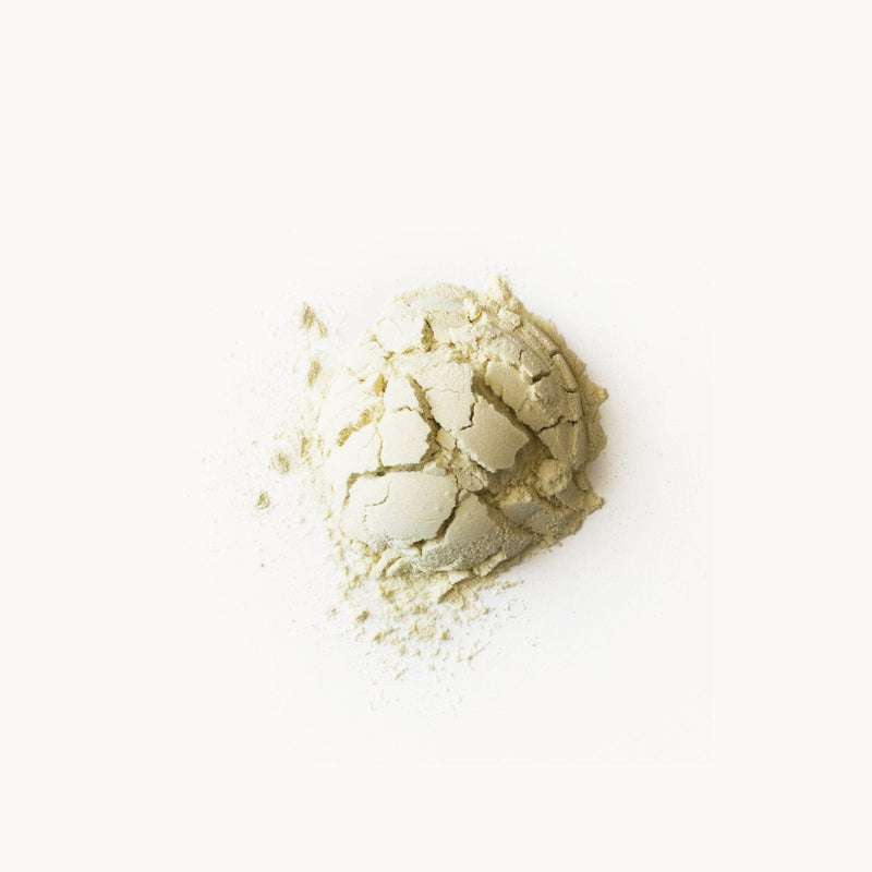 A white powder of Passionfruit Amla Gotu Kola by Rishi Tea & Botanicals on a white background.