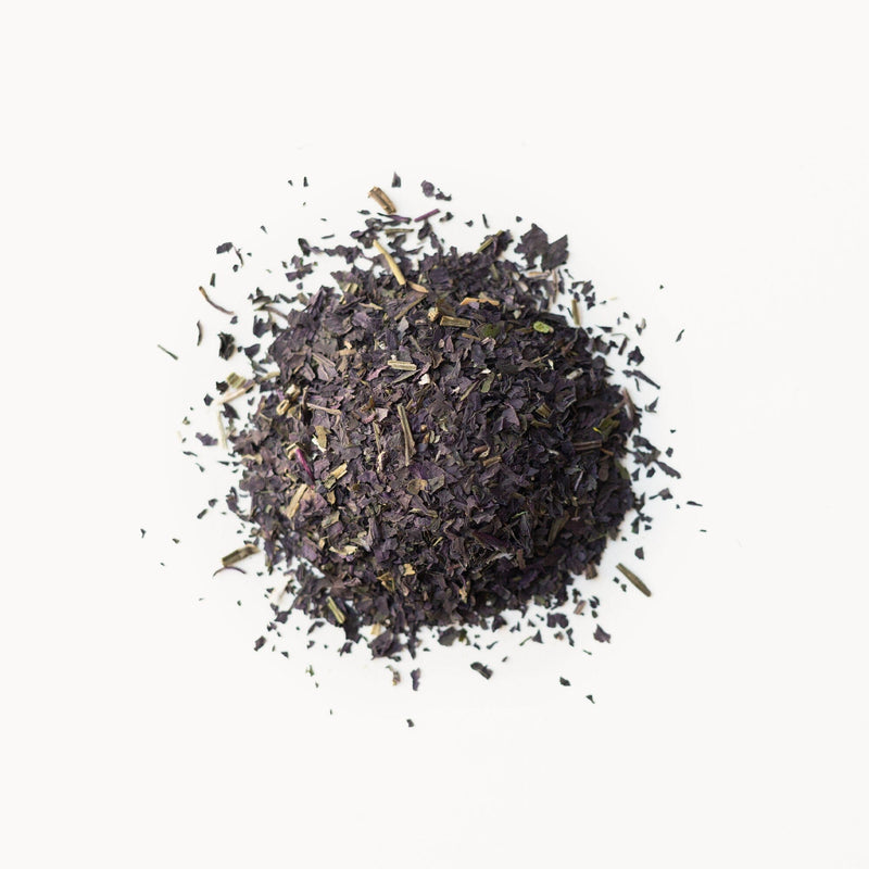 A pile of Red Shiso tea from Rishi Tea & Botanicals on a white background.
