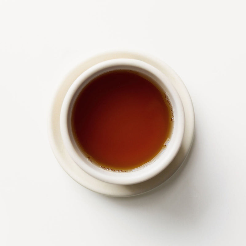 A cup of Spicy Masala Chai from Rishi Tea & Botanicals on a white background.