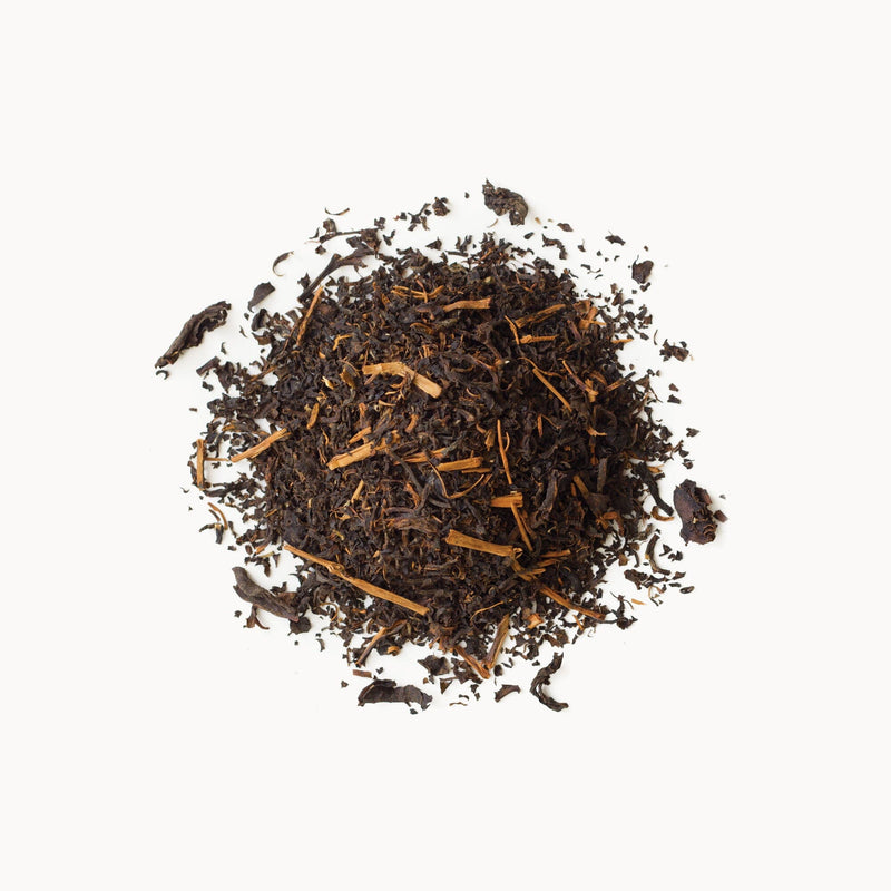 A pile of Wild Thai Black tea from Rishi Tea & Botanicals on a white background.