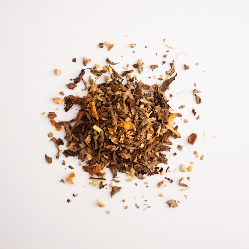 A pile of Cinnamon Tulsi Spice from Rishi Tea & Botanicals on a white background.