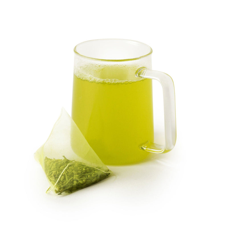A mug of Matcha Genmaicha Double-Dose green tea brewed from extra-filled double-dose sachets by Rishi Tea & Botanicals.