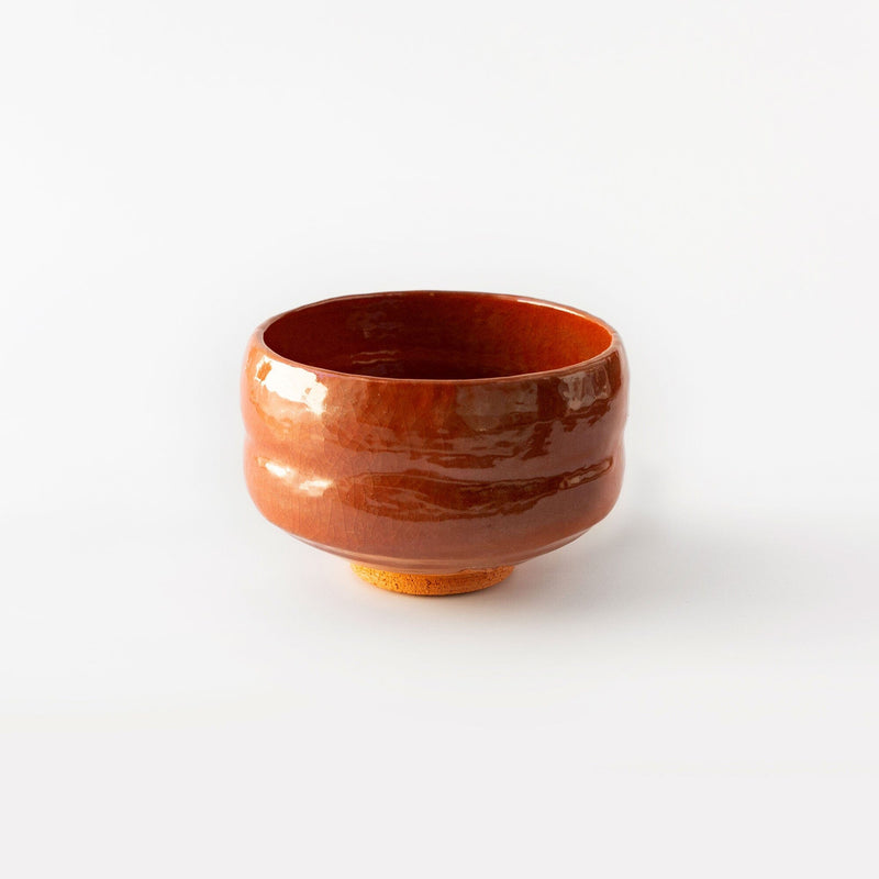 This handcrafted Amber Shoraku Matcha Bowl, from Chato Co., Ltd., showcases a rich amber glaze, capturing the beauty of natural earth tones. Whether you are whisking up a traditional matcha or using it as a unique centerpiece.