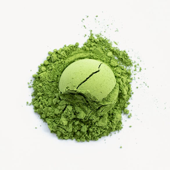 A bowl of green Matcha Hekisui powder on a white background, offered by Rishi Tea & Botanicals.