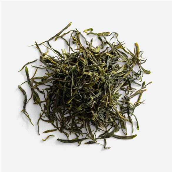 A pile of Yu Ya Jade Buds on a white background, from Rishi Tea & Botanicals.