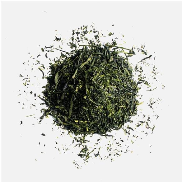 A pile of Nishi Shincha Asatsuyu green tea on a white background by Rishi Tea & Botanicals.
