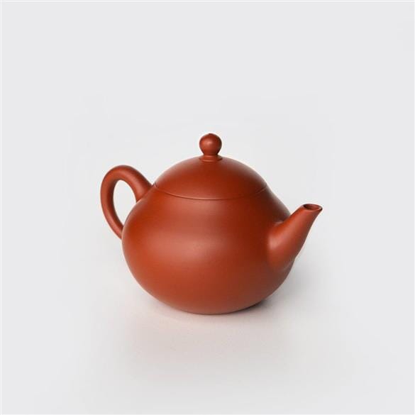 A Pear Teapot by Rishi Tea & Botanicals on a white background.