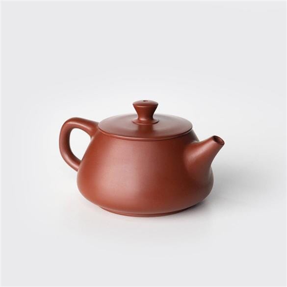 A small brown Stone Ladle Teapot by Rishi Tea & Botanicals on a white background.